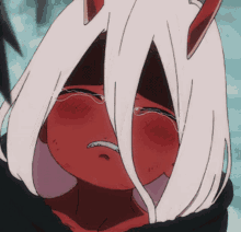 a girl with red and white hair is crying with tears coming out of her eyes
