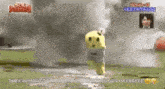 a stuffed animal is standing in the middle of a field with smoke coming out of it .