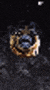 a blurry picture of a glowing object in the dark