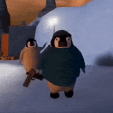 a couple of penguins standing next to each other in the snow holding guns .