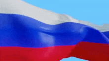 a close up of a russian flag waving in the wind .