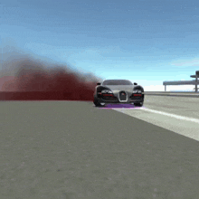 a bugatti is driving down a highway with smoke coming out of the exhaust pipe
