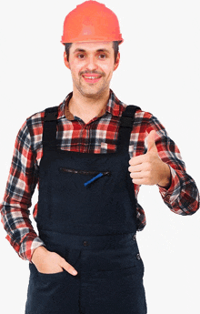 a man wearing overalls and an orange hard hat is giving a thumbs up