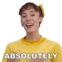 a woman wearing a yellow shirt that says absolutely on it