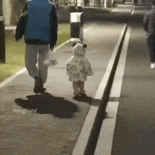 a man and a little girl are walking down a sidewalk with hangseed written on the bottom of the image
