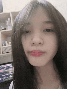 a woman 's face is shown in front of a computer screen which says 8:18