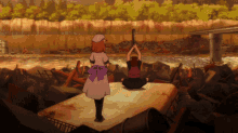 a girl in a white dress with a purple bow is standing next to a boy in a red backpack