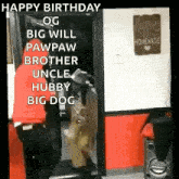 a man is standing in front of a door with a sign that says happy birthday .