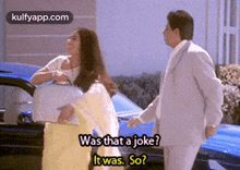 a man and a woman are standing next to each other and the man is asking the woman if she is a joke