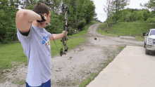 firing kendall gray bow aim shoot