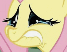 a close up of a cartoon character 's face with tears running down its eyes .