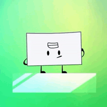 a white rectangle with arms and legs is standing on a green table .