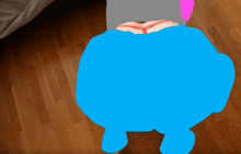a blue drawing of a person 's butt on a wood floor