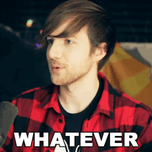 a man in a plaid shirt says whatever in white letters