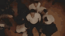 a group of people are dancing in a room with the words `` bitch '' written on the screen .