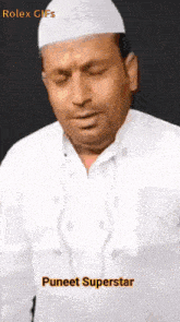 a man is wearing a white hat and a white shirt and the name puneet superstar is on the bottom