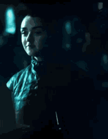 a close up of a person in a dark room