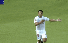a soccer player with the number 32 on his shorts