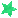 a green star on a white background with a blurred background