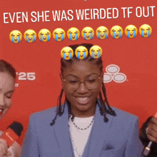 a woman holding a sign that says " even she was weirded tf out " on it