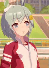 a girl with a flower in her hair is wearing a red and white jacket and smiling .