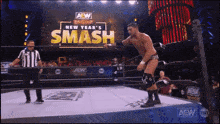 a man in a wrestling ring with a sign that says smash on it