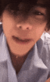 a close up of a person 's face with their mouth open .