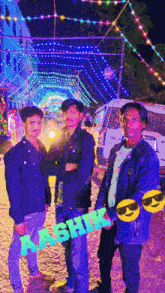 a group of young men are posing for a photo with a sign that says aashir