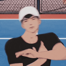 a man wearing a white hat and a black shirt is standing on a blue tennis court .