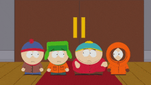 a group of south park characters standing in front of a brown door