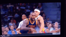 a basketball game is being played on a television screen