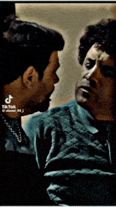 two men are looking at each other with tiktok written on the bottom right corner
