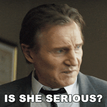 a man in a suit and tie is being asked if she is serious