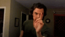 a blurry picture of a man 's face with a checkered wall in the background