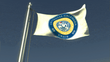 a white flag with a blue and yellow emblem that says universitas airlangga on it