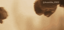 a blurred image of a person 's face with the hashtag @avantika_0902
