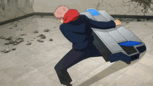 a man in a red hoodie is pushing a machine on the ground