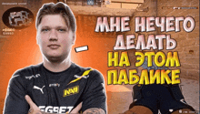 a man in a navi shirt stands in front of a brick wall