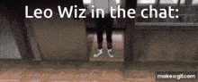 a person standing in a doorway with the words " leo wiz in the chat " above them