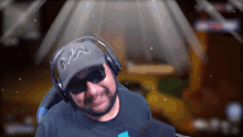 a man wearing headphones and a hat that says nw