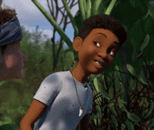 a boy in a white shirt with a necklace around his neck is smiling