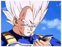 vegeta from dragon ball z is holding a cell phone in his hand .