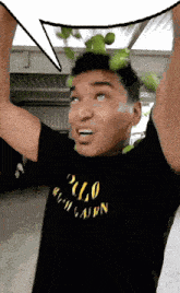 a man wearing a black polo ralph lauren t-shirt holds up his arms
