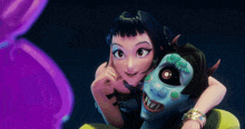 a girl and a monster are posing for a picture in a dark room