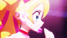 a girl with blonde hair and blue eyes is holding a pink heart in her mouth