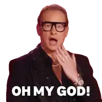 a man in a black suit and glasses says oh my god