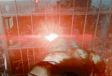 a red light is shining on a building with the word kepler on the bottom right