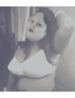 a black and white photo of a woman wearing a bra