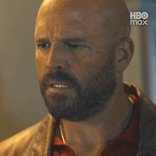 a bald man with a beard is looking at the camera with hbo max in the corner