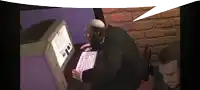 a man in a suit is typing on a computer with a speech bubble above him